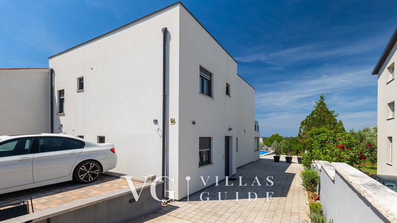 Villa La Perla Garden and property exterior