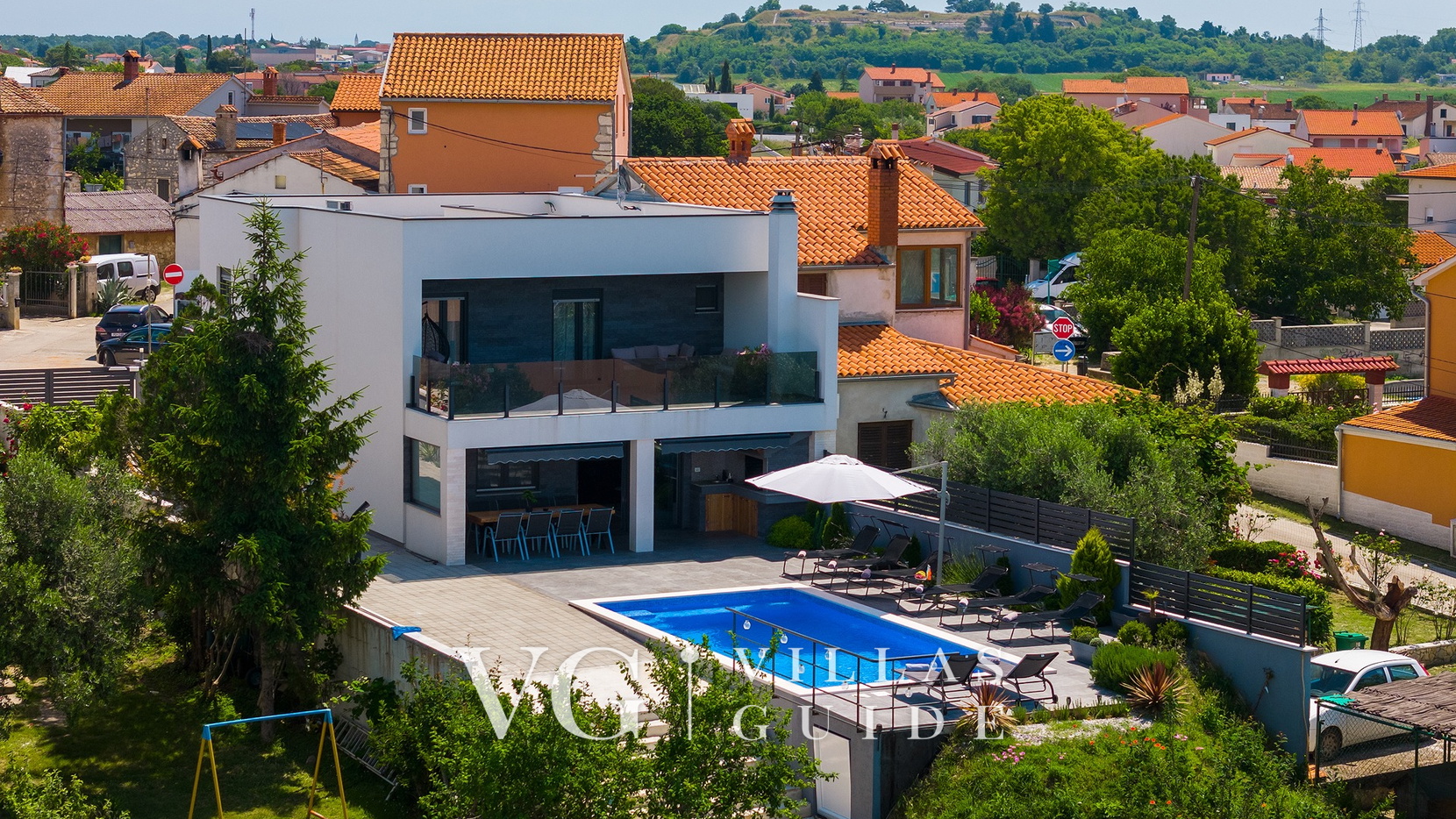 Villa La Perla Garden and property exterior